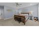 Main bedroom with wood bed frame and neutral decor at 13671 Burgess Rd, Middlesex, NC 27557