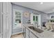 Kitchen with granite countertops, stainless steel sink, and view to backyard at 13671 Burgess Rd, Middlesex, NC 27557