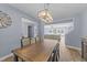 Open concept dining room with a view into the living room and kitchen at 13671 Burgess Rd, Middlesex, NC 27557