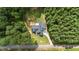 House nestled in a wooded area with a long driveway at 13671 Burgess Rd, Middlesex, NC 27557