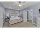 Main bedroom with king-size bed, ceiling fan, and access to en-suite bathroom at 13671 Burgess Rd, Middlesex, NC 27557