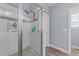 Shower with glass enclosure and white tile at 13671 Burgess Rd, Middlesex, NC 27557