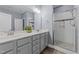 Modern bathroom with double vanity and walk-in shower at 13671 Burgess Rd, Middlesex, NC 27557