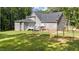 Spacious backyard with deck, fenced area, and lush lawn at 13671 Burgess Rd, Middlesex, NC 27557