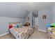 Cozy bedroom with a firetruck themed bedspread at 13671 Burgess Rd, Middlesex, NC 27557