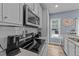 Well-equipped kitchen with granite counters and stainless steel appliances at 13671 Burgess Rd, Middlesex, NC 27557