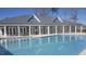 Community swimming pool with adjacent clubhouse at 15 Hornbeam Rd, Youngsville, NC 27596