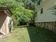 Side yard with shed and mature trees at 3716 Pearl Rd, Raleigh, NC 27610