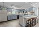 Galley kitchen with light blue cabinets and appliances at 3716 Pearl Rd, Raleigh, NC 27610