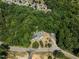 Aerial view showing house surrounded by trees at 3716 Pearl Rd, Raleigh, NC 27610