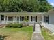 House exterior with a covered porch and ramp access at 3716 Pearl Rd, Raleigh, NC 27610