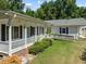 Ranch home featuring covered porch, ramp, and side yard at 3716 Pearl Rd, Raleigh, NC 27610