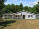 Ranch-style home with front porch and lawn at 3716 Pearl Rd, Raleigh, NC 27610