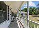 Front porch with white railings and access to front door at 3716 Pearl Rd, Raleigh, NC 27610