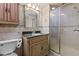 Bathroom with dark brown vanity and shower at 3716 Pearl Rd, Raleigh, NC 27610