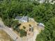 Aerial view showing house, shed, and wooded area at 3716 Pearl Rd, Raleigh, NC 27610