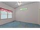 Spacious bedroom with blue carpet and a window at 3716 Pearl Rd, Raleigh, NC 27610