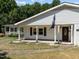 House exterior showcasing front porch, entryway and landscaping at 3716 Pearl Rd, Raleigh, NC 27610
