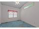 Bedroom with light-blue carpet and window at 3716 Pearl Rd, Raleigh, NC 27610