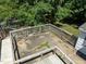 Concrete patio with wooden deck and railings at 3716 Pearl Rd, Raleigh, NC 27610