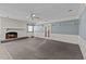 Living room with brick fireplace and carpet flooring at 3716 Pearl Rd, Raleigh, NC 27610