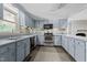 L-shaped kitchen with stainless steel appliances at 3716 Pearl Rd, Raleigh, NC 27610