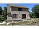 House exterior showcasing stone foundation, patio, and rear view at 901 Tanglewood Dr, Siler City, NC 27344