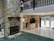 Kitchen features an island, wood cabinets, and black appliances at 901 Tanglewood Dr, Siler City, NC 27344