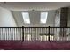 Open upper landing with two skylights and view of the lower level at 901 Tanglewood Dr, Siler City, NC 27344