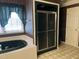 Bathroom with soaking tub, double vanity, and shower at 901 Tanglewood Dr, Siler City, NC 27344