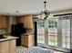 Kitchen with access to backyard patio through french doors at 901 Tanglewood Dr, Siler City, NC 27344