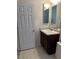 Clean bathroom with dark vanity and tiled floor at 506 Averasboro Dr, Clayton, NC 27520