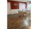 Bright dining room with hardwood floors and seating for four at 506 Averasboro Dr, Clayton, NC 27520