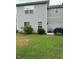 House exterior and backyard with patio and grass at 506 Averasboro Dr, Clayton, NC 27520