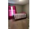 Small bedroom with twin bed and pink curtains at 506 Averasboro Dr, Clayton, NC 27520