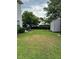 Backyard with storage shed and grassy area at 506 Averasboro Dr, Clayton, NC 27520
