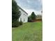 Landscaped backyard with privacy fence at 506 Averasboro Dr, Clayton, NC 27520