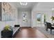 Elegant foyer with hardwood floors and a sitting bench at 816 Willow Tower Ct # 154, Rolesville, NC 27571