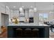 Modern kitchen with island, stainless steel appliances, and white cabinetry at 816 Willow Tower Ct # 154, Rolesville, NC 27571