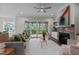 Cozy living room with fireplace, large windows, and access to a screened porch at 816 Willow Tower Ct # 154, Rolesville, NC 27571