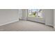 Spacious bedroom with neutral carpeting and large window at 816 Willow Tower Ct # 154, Rolesville, NC 27571