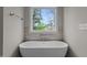 Free-standing bathtub with window overlooking backyard at 816 Willow Tower Ct # 154, Rolesville, NC 27571