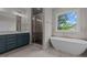 Elegant bathroom with soaking tub, walk-in shower, and double vanity at 816 Willow Tower Ct # 154, Rolesville, NC 27571