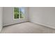 Bright bedroom with plush carpeting and large window at 816 Willow Tower Ct # 154, Rolesville, NC 27571