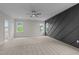 Bright bedroom with gray accent wall and access to a bathroom at 816 Willow Tower Ct # 154, Rolesville, NC 27571