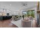 Open concept living room and kitchen with hardwood floors and a fireplace at 816 Willow Tower Ct # 154, Rolesville, NC 27571