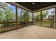 Relaxing screened porch with wood flooring and backyard view at 816 Willow Tower Ct # 154, Rolesville, NC 27571