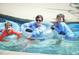 Gathering fun at the community pool with water tubes at 816 Willow Tower Ct # 154, Rolesville, NC 27571