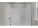 White shower and bathtub combo with built-in shelving at 816 Willow Tower Ct # 154, Rolesville, NC 27571