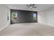 Spacious bedroom with dark gray accent wall and carpet flooring at 816 Willow Tower Ct # 154, Rolesville, NC 27571